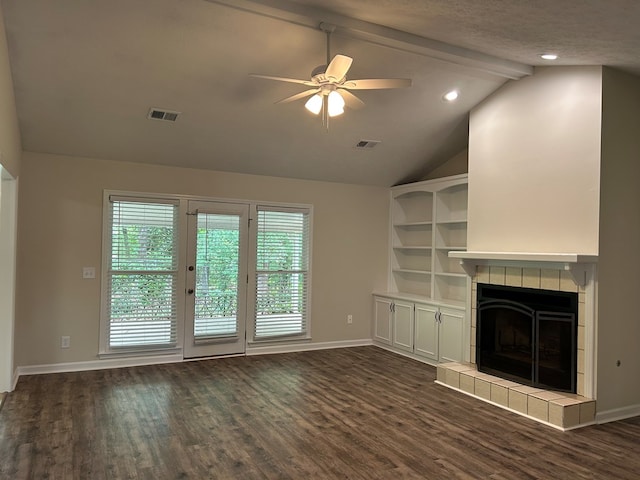 unfurnished living room with ceiling fan, dark wood-style flooring, visible vents, baseboards, and lofted ceiling with beams