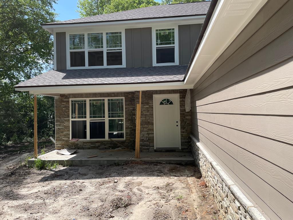 entrance to property with stone siding