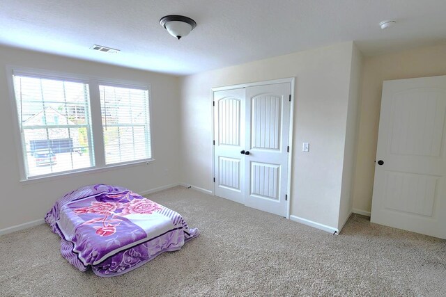 239 Clearbrook Ln, Columbus, GA 31904 - carpeted bedroom with a closet and baseboards