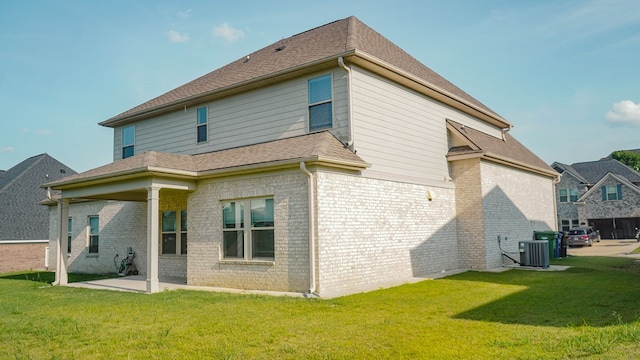 239 Clearbrook Ln, Columbus, GA 31904 - rear view of house with brick siding, a patio, central AC, and a yard
