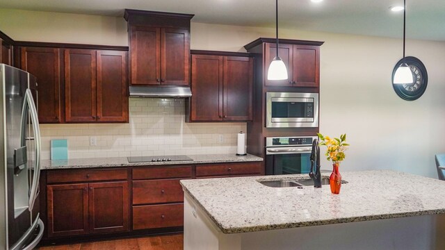 239 Clearbrook Ln, Columbus, GA 31904 - kitchen featuring stainless steel appliances, a sink, backsplash, dark wood-type flooring, and reddish brown cabinets