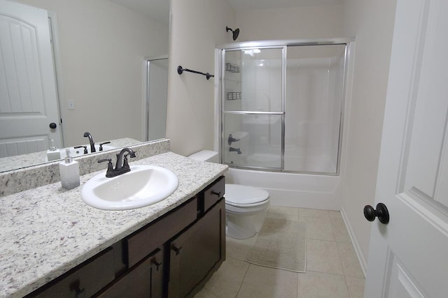 239 Clearbrook Ln, Columbus, GA 31904 - bathroom with toilet, tile patterned floors, vanity, and shower / bath combination with glass door