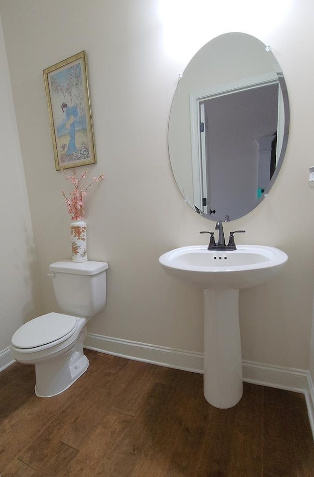 239 Clearbrook Ln, Columbus, GA 31904 - half bath featuring wood finished floors, baseboards, toilet, and a sink