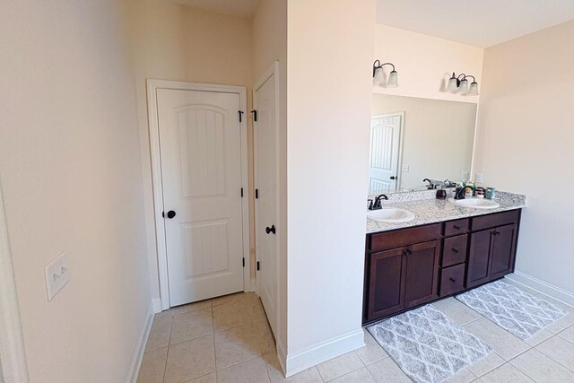 239 Clearbrook Ln, Columbus, GA 31904 - bathroom with baseboards, tile patterned flooring, and double vanity