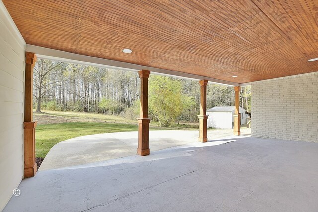 view of patio / terrace with an outbuilding