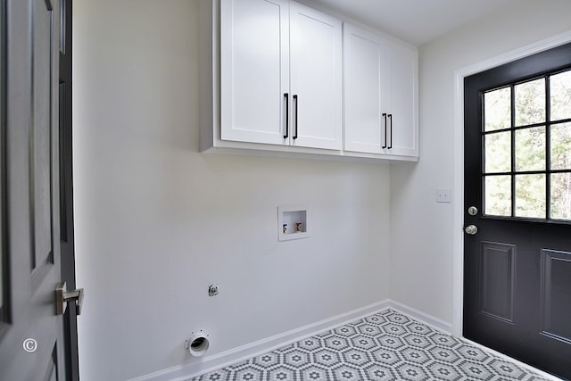 laundry area featuring hookup for a washing machine, cabinet space, hookup for an electric dryer, and baseboards