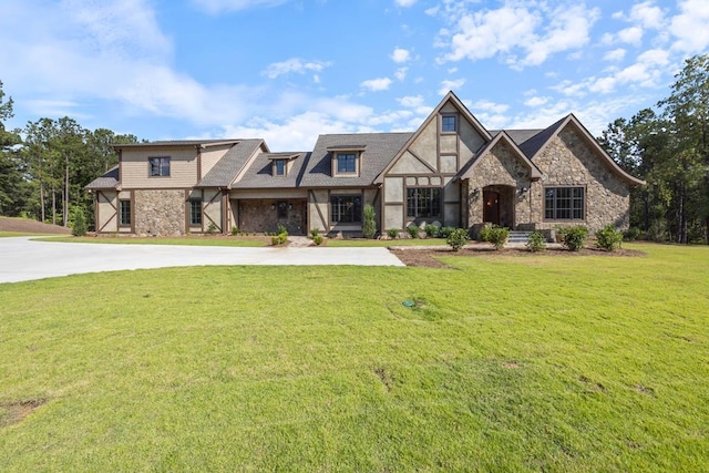 tudor house featuring a front yard