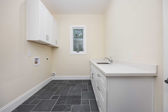 laundry room with washer hookup, electric dryer hookup, cabinets, and sink