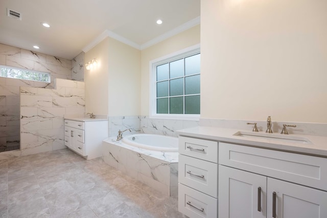 bathroom featuring vanity, a healthy amount of sunlight, ornamental molding, and tiled bath