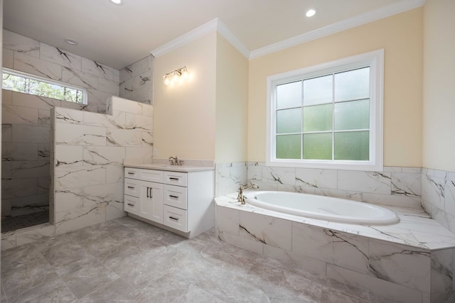 bathroom with vanity, tiled bath, a wealth of natural light, and ornamental molding