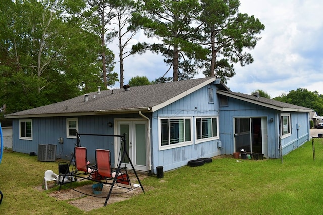 5045 Old Post Rd, Columbus, GA 31909 - rear view of house with a lawn and a shingled roof