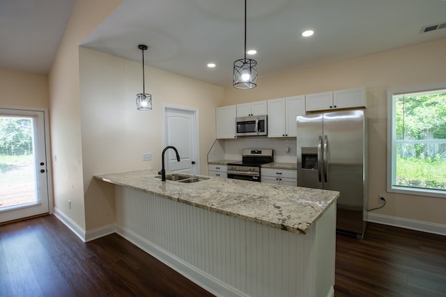 923 Omega Dr, Columbus, GA 31907 - kitchen featuring stainless steel appliances, dark wood finished floors, a peninsula, white cabinetry, and recessed lighting