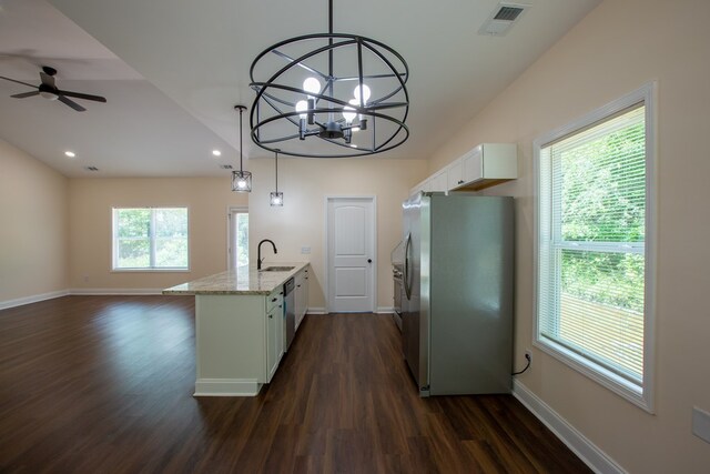 923 Omega Dr, Columbus, GA 31907 - kitchen with appliances with stainless steel finishes, white cabinets, dark wood finished floors, open floor plan, and a peninsula