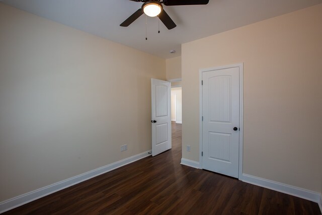 923 Omega Dr, Columbus, GA 31907 - unfurnished bedroom with dark wood-style flooring and a ceiling fan
