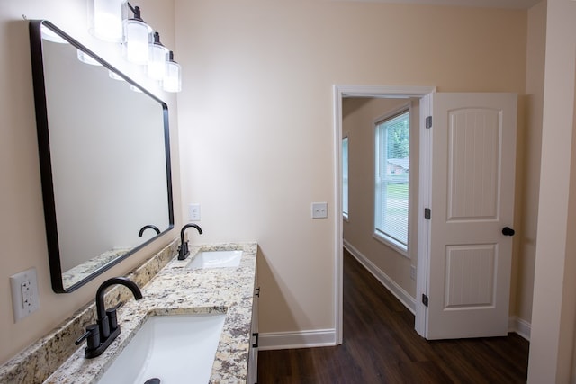 923 Omega Dr, Columbus, GA 31907 - bathroom with wood finished floors and double vanity