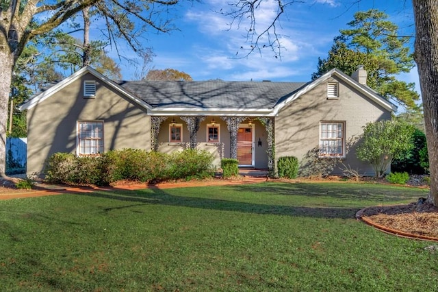 single story home with a front yard