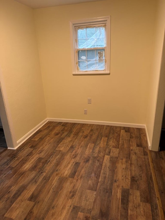 empty room with dark hardwood / wood-style floors