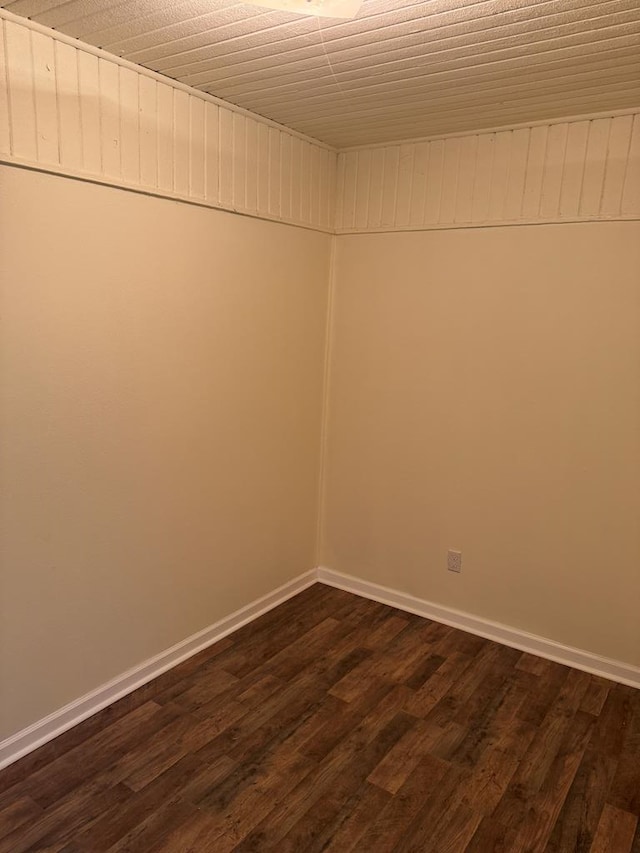 empty room with dark hardwood / wood-style floors