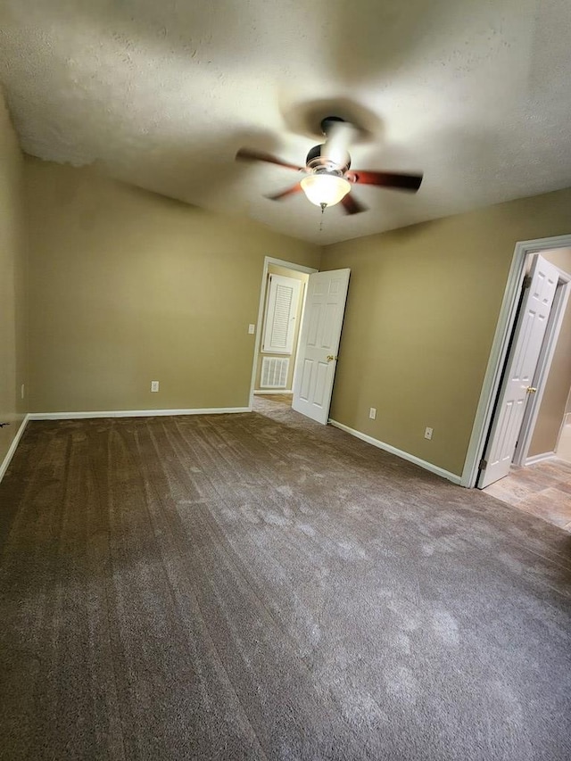 unfurnished bedroom with baseboards, carpet, and ceiling fan
