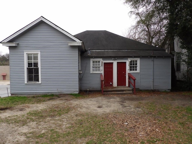 back of house with entry steps