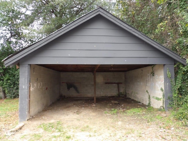 view of outbuilding with a carport