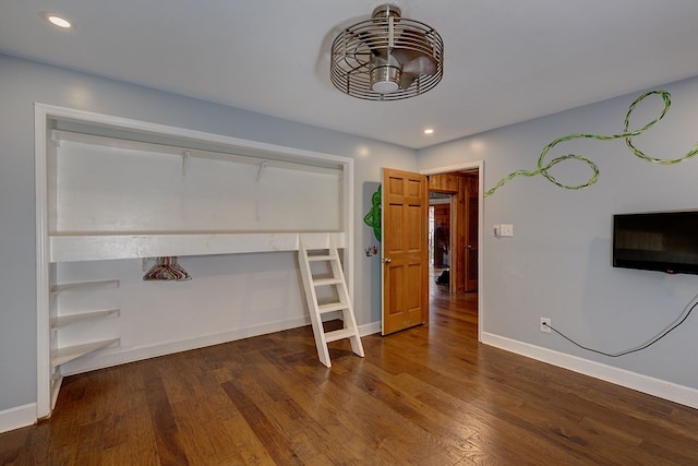 unfurnished bedroom with dark hardwood / wood-style floors