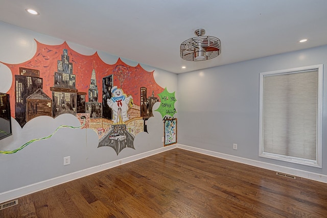 empty room featuring wood-type flooring