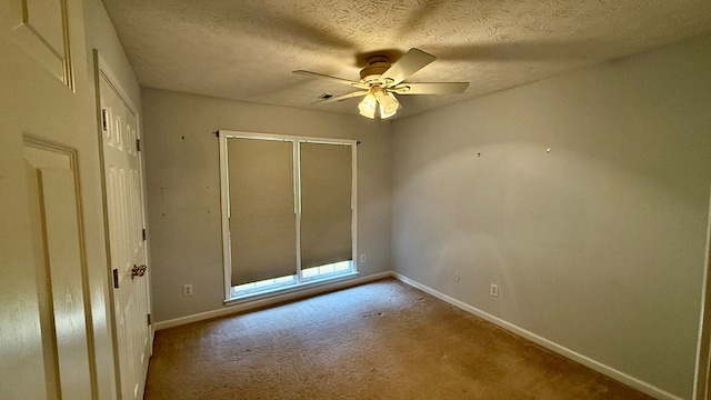 unfurnished bedroom with ceiling fan, a closet, and a textured ceiling