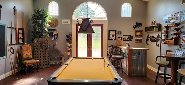 playroom with dark wood-type flooring, pool table, and a high ceiling