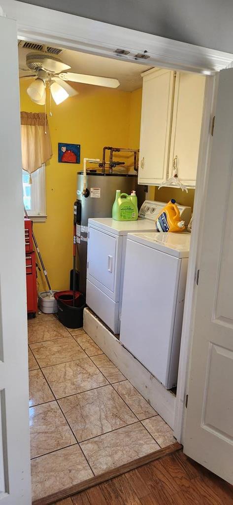 laundry area with cabinets, independent washer and dryer, light wood-type flooring, and ceiling fan