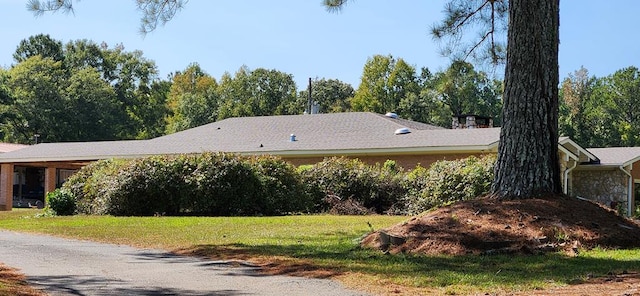 view of home's exterior with a yard