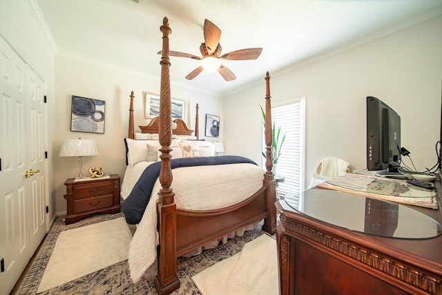 bedroom with a closet, ceiling fan, and crown molding