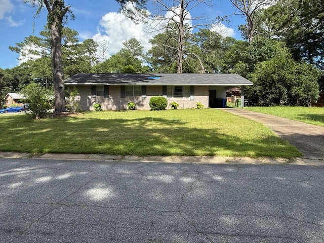 4520 Marci Ct, Columbus, GA 31907 - ranch-style house featuring driveway, a front yard, and a carport