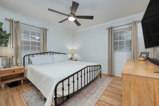 4502 Northwood Ave, Columbus, GA 31907 - bedroom featuring light wood finished floors, ornamental molding, a ceiling fan, and wooden walls