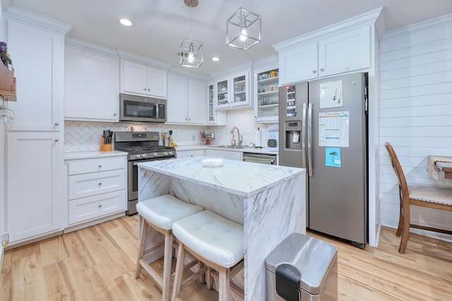 4502 Northwood Ave, Columbus, GA 31907 - kitchen with appliances with stainless steel finishes, light wood-style floors, decorative backsplash, white cabinetry, and recessed lighting