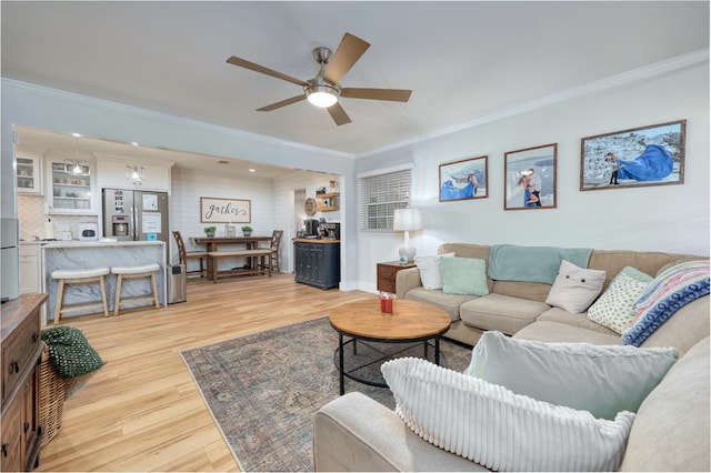 4502 Northwood Ave, Columbus, GA 31907 - living area featuring a ceiling fan, light wood-type flooring, and ornamental molding