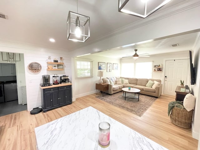 4502 Northwood Ave, Columbus, GA 31907 - living room with ornamental molding, light wood-type flooring, a ceiling fan, and baseboards