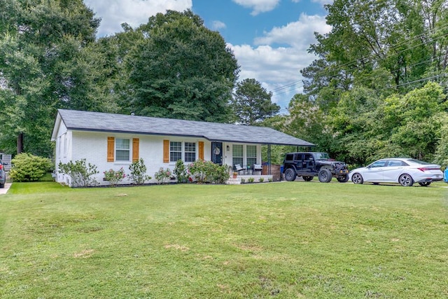 4502 Northwood Ave, Columbus, GA 31907 - ranch-style house with covered porch, a front lawn, and brick siding