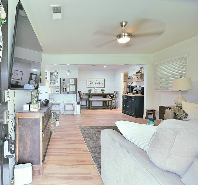 4502 Northwood Ave, Columbus, GA 31907 - living room featuring ceiling fan, crown molding, and light wood-style floors