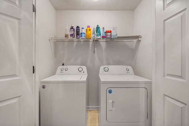 701 Crestline Dr, Columbus, GA 31907 - laundry area with washing machine and dryer and a textured ceiling