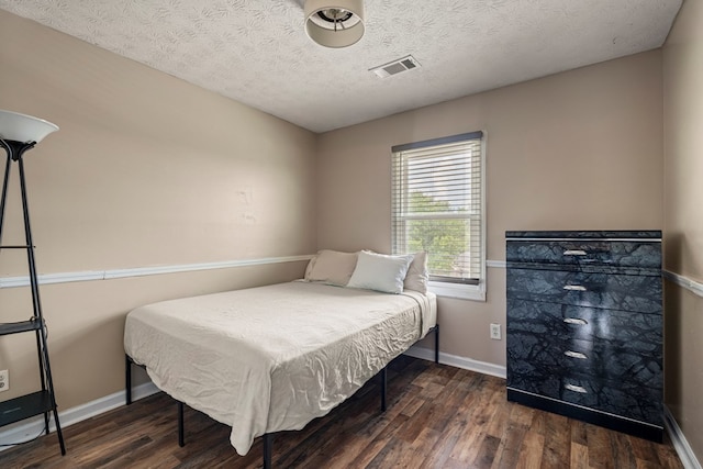 701 Crestline Dr, Columbus, GA 31907 - bedroom featuring wood finished floors and a textured ceiling