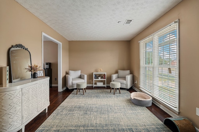701 Crestline Dr, Columbus, GA 31907 - living area with dark wood-type flooring and a textured ceiling