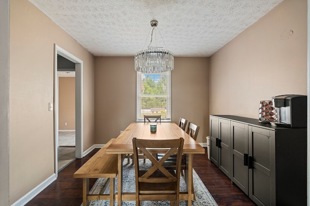 701 Crestline Dr, Columbus, GA 31907 - dining area with a chandelier, dark wood finished floors, and a textured ceiling
