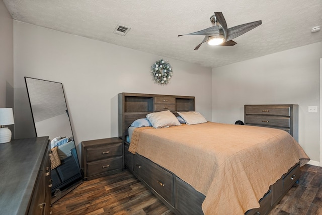 701 Crestline Dr, Columbus, GA 31907 - bedroom featuring dark wood-style flooring, a ceiling fan, and a textured ceiling