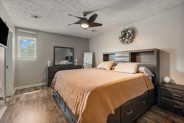 701 Crestline Dr, Columbus, GA 31907 - bedroom featuring dark wood-type flooring, a textured ceiling, and ceiling fan
