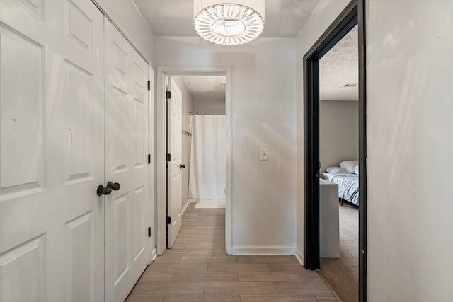 701 Crestline Dr, Columbus, GA 31907 - hall featuring a textured ceiling and light wood finished floors