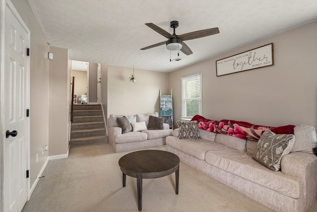 701 Crestline Dr, Columbus, GA 31907 - carpeted living room featuring a ceiling fan, stairs, and a textured ceiling