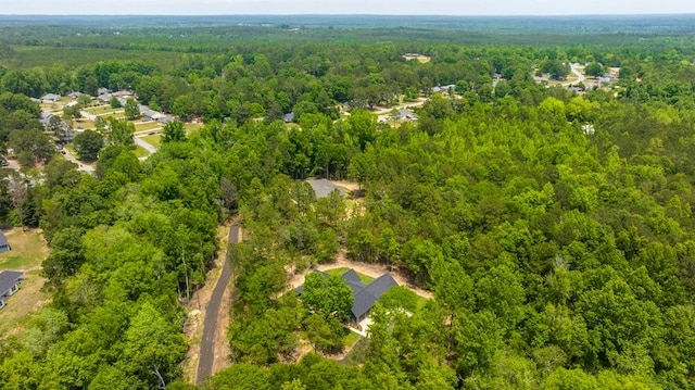 drone / aerial view of a heavily wooded area