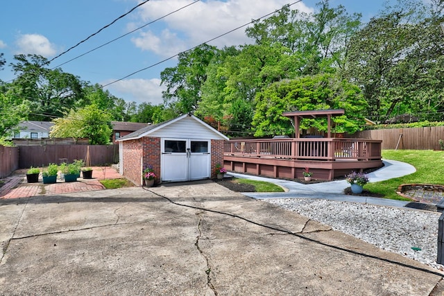 view of outbuilding with a fenced backyard and an outdoor structure