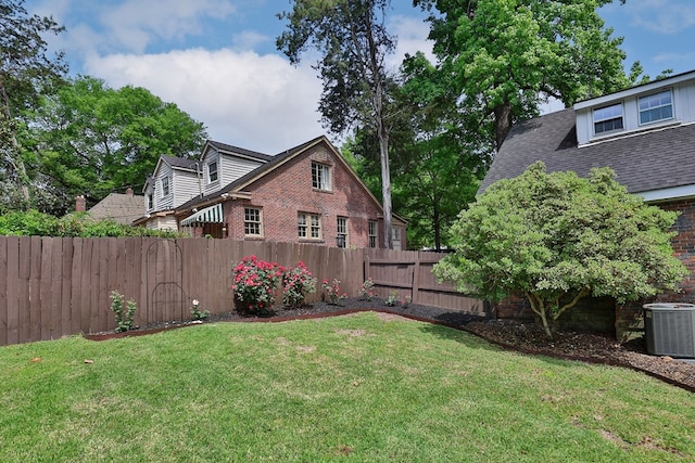view of yard featuring fence and cooling unit
